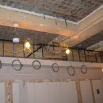 existing-concrete-deck-above-finished-ceilings-during-construction